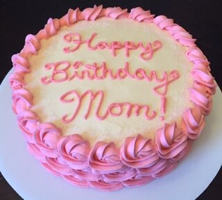 Rosette sided cake with cream cheese frosting fill and top with accent sugar crystals.