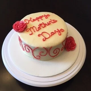This was a red velvet cake with lemon exterior frost and red raspberry fill and script/flowers.