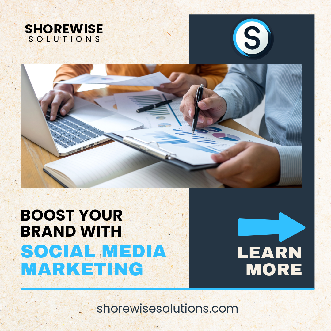 Two people discussing graphs and charts on paper with a laptop, featuring text 'Boost Your Brand with Social Media Marketing,' 'Learn More,' 'Shorewise Solutions.'