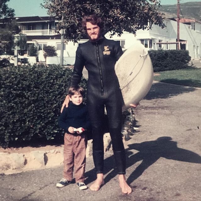 1972 on a visit to Laguna Beach, with my nephew just before I paddled out. Still wearing that same first full wetsuit, a SeaSuit with metal zippers on the sleeves and legs and front. Note the shock-cord from the marine supply store for a leash. This 