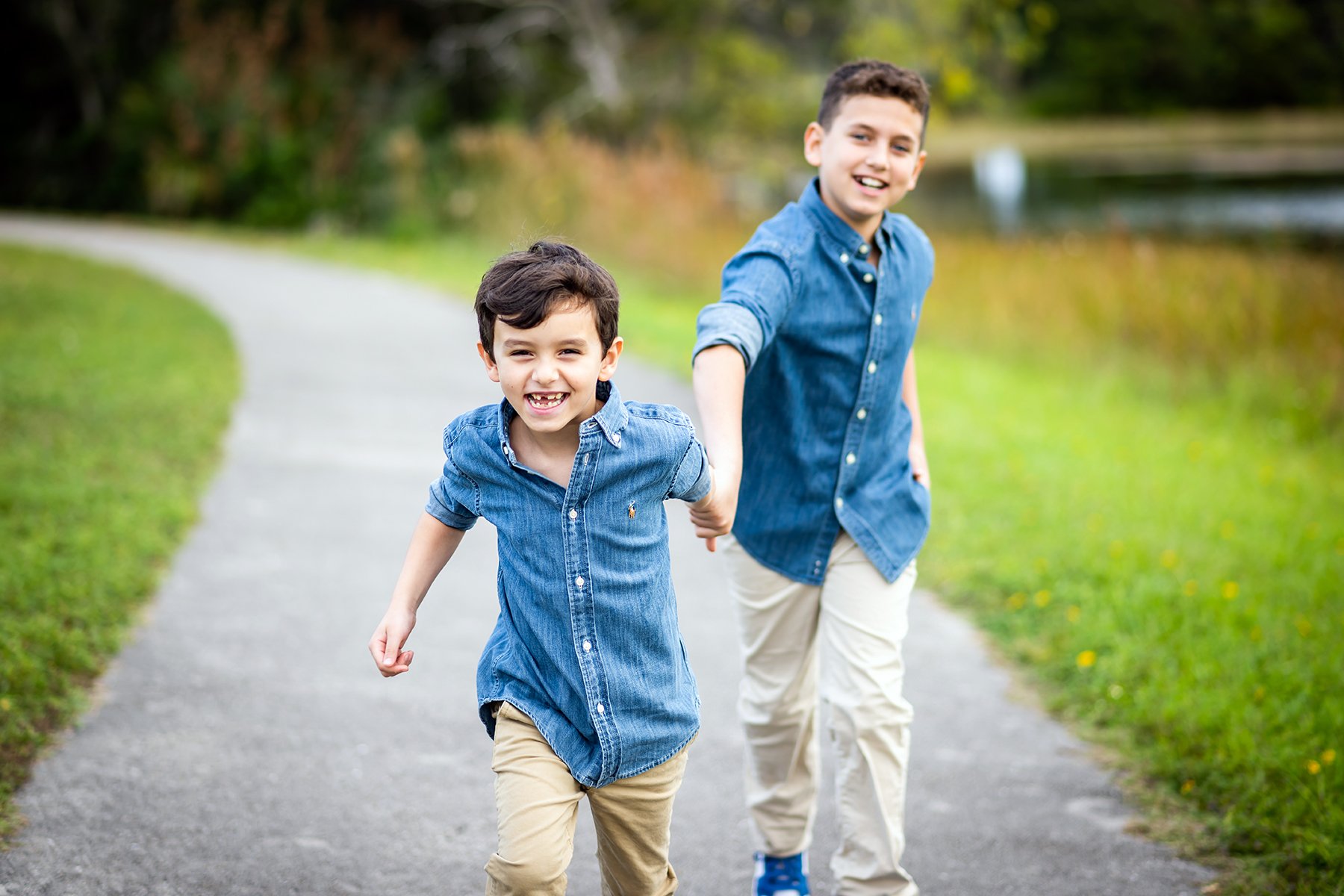Brothers running and smiling together
