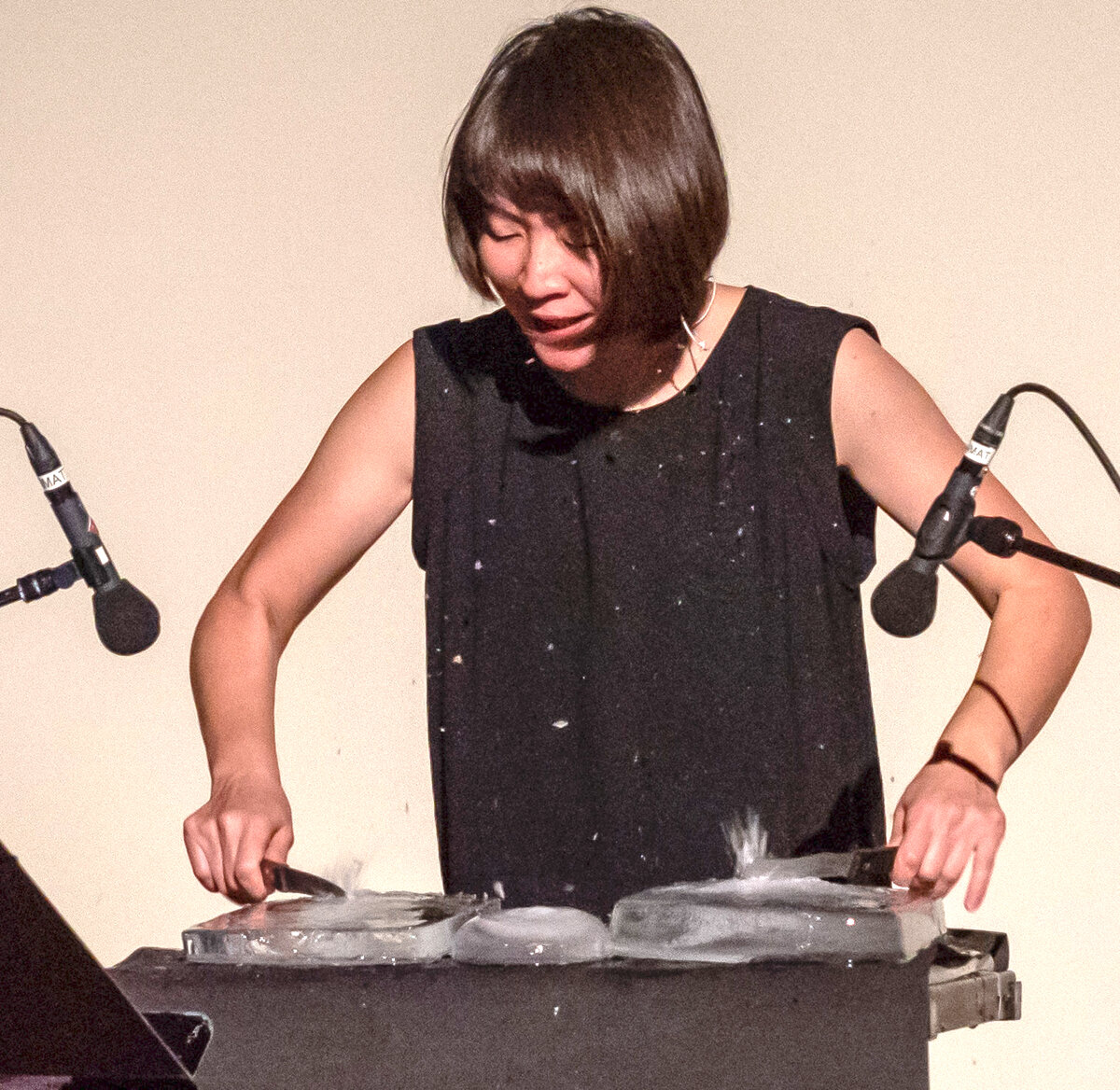  “The Ice is Talking,” Haruka Fujii, percussionist playing on blocks of ice. [Photo by Stephen B. Hahn] 
