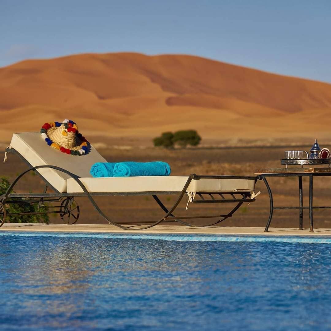 Pretty place to enjoy your day in sahara desert 🏊&zwj;♀️🏊&zwj;♂️ .
.
.
.
Merzouga Sahara Desert Morocco, : 
📸@morocco_view_tours ⛺🐪
.
.
.
.
.
.
📧 Book your trip, night luxury camp, quads biking here: 🚩 www.moroccoview.com 
.
.
.
Or: info.morocc