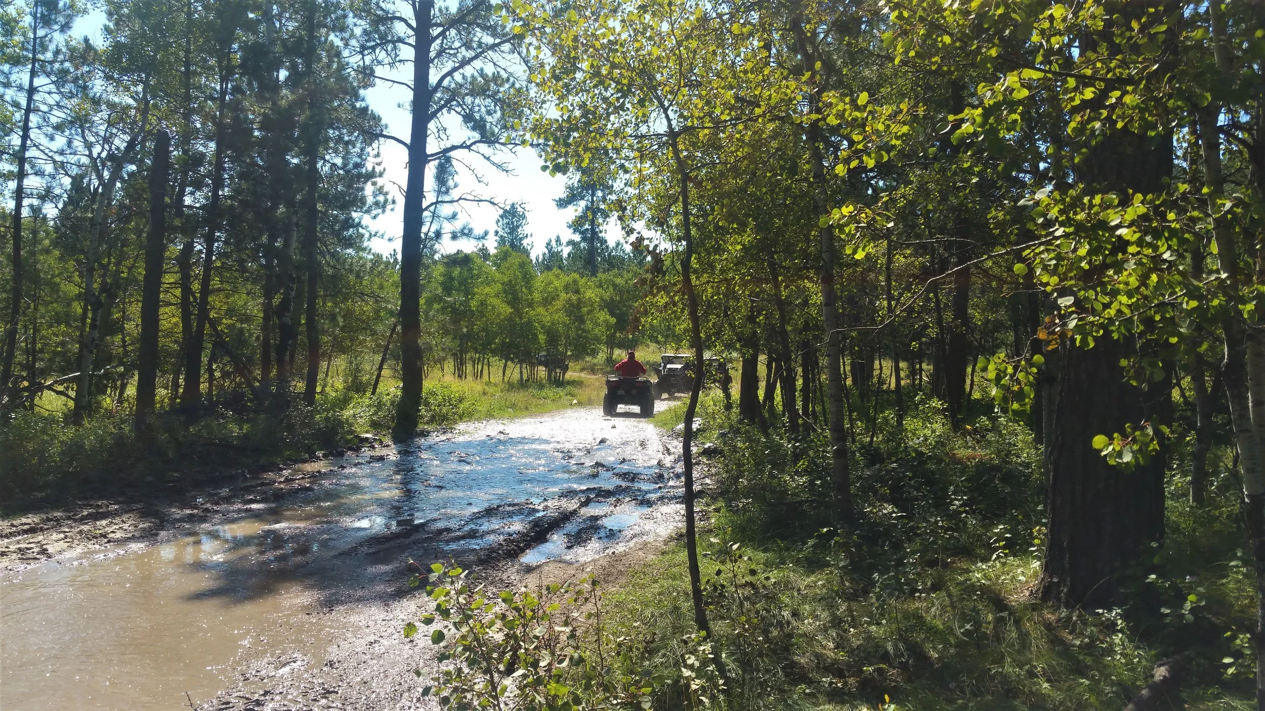 Saw hundreds of atvs on the trail all day - some as much as 30 at a time. Has to step off the trail quite a bit to make room for passing vehicles. Notice all the mud - had to go through quite a bit at time.