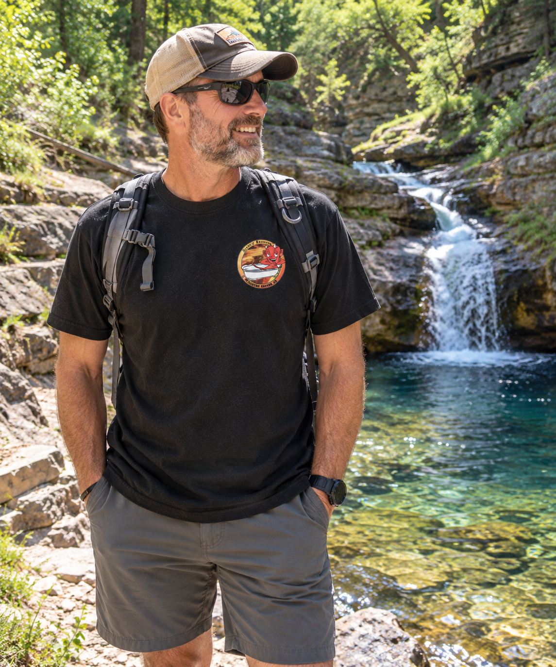 Hiker by a Sunlit Canyon Waterfall.png