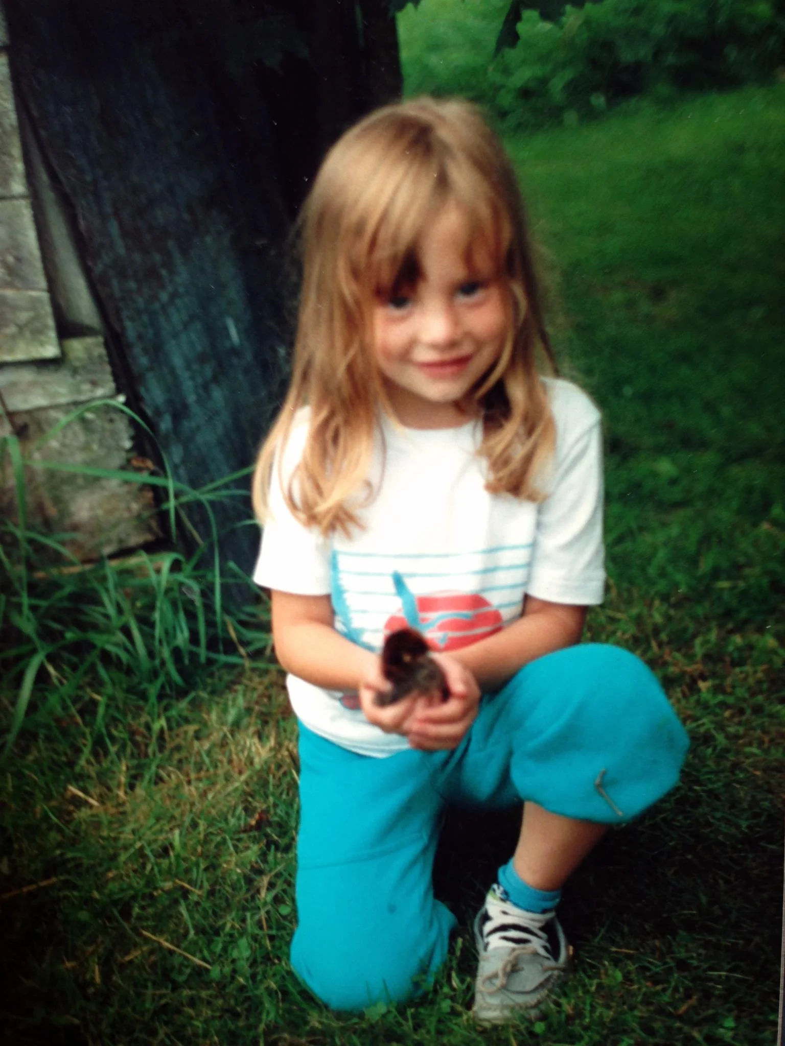 Me as a kiddo holding a chick