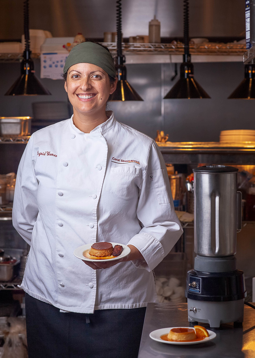 The Canal Street Bistro in New Orleans serves a flan dish that has been in the family for more than 20 years. Top: An orange flan. Above: Ingrid Thomas with the blender used to make the flan. Below: Plantain-and-rum-flavored flan. Photographs by Andre’ LaFleur/IslandandSpice.com