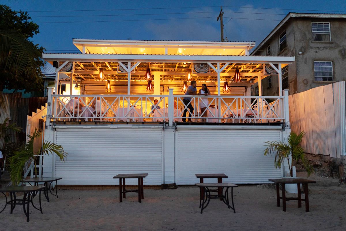 The Top Deck by Jason Howard (left) overlooks the Caribbean Sea. Photographs by Nigel Wallace/IslandandSpice.com