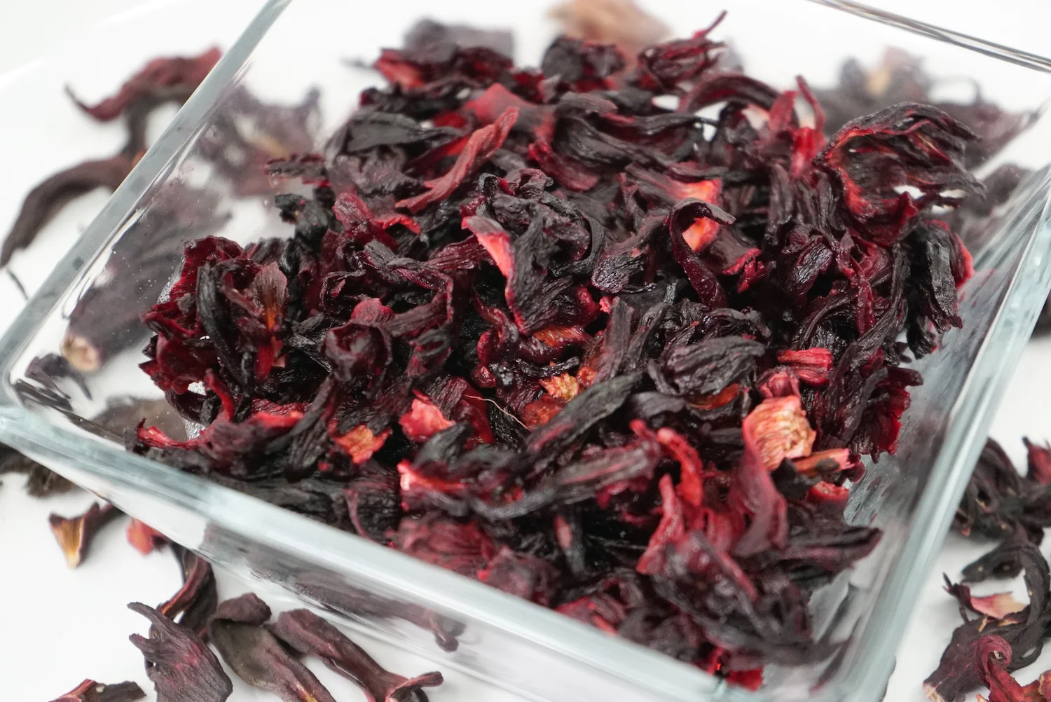 Sorrel is made from brewing the flower petals of the roselle plant, a type of hibiscus that is native to India. The plant way brought to Africa and then to the New World. The drink is made by boiling the dried petals, above.