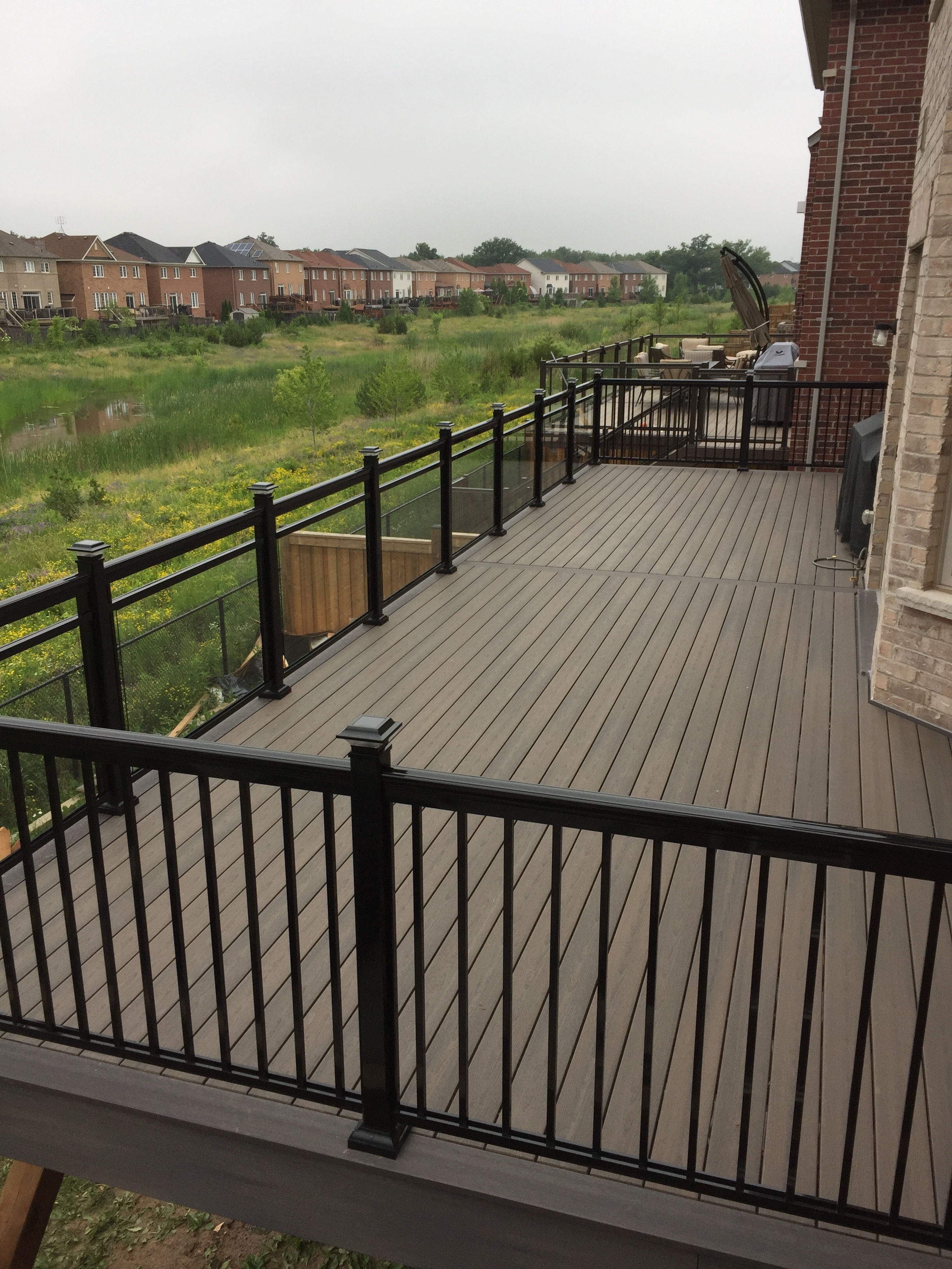 Fiberon Deck with Dalmar Aluminum glass railings.