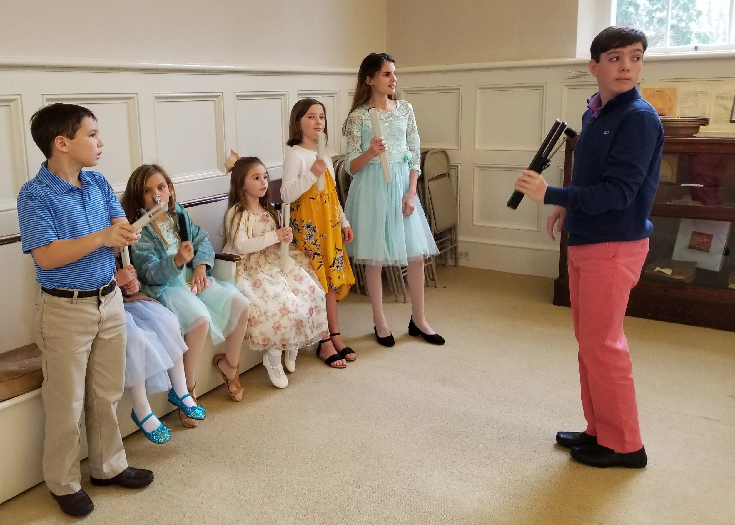 Children playing chimes at the start of the worship service
