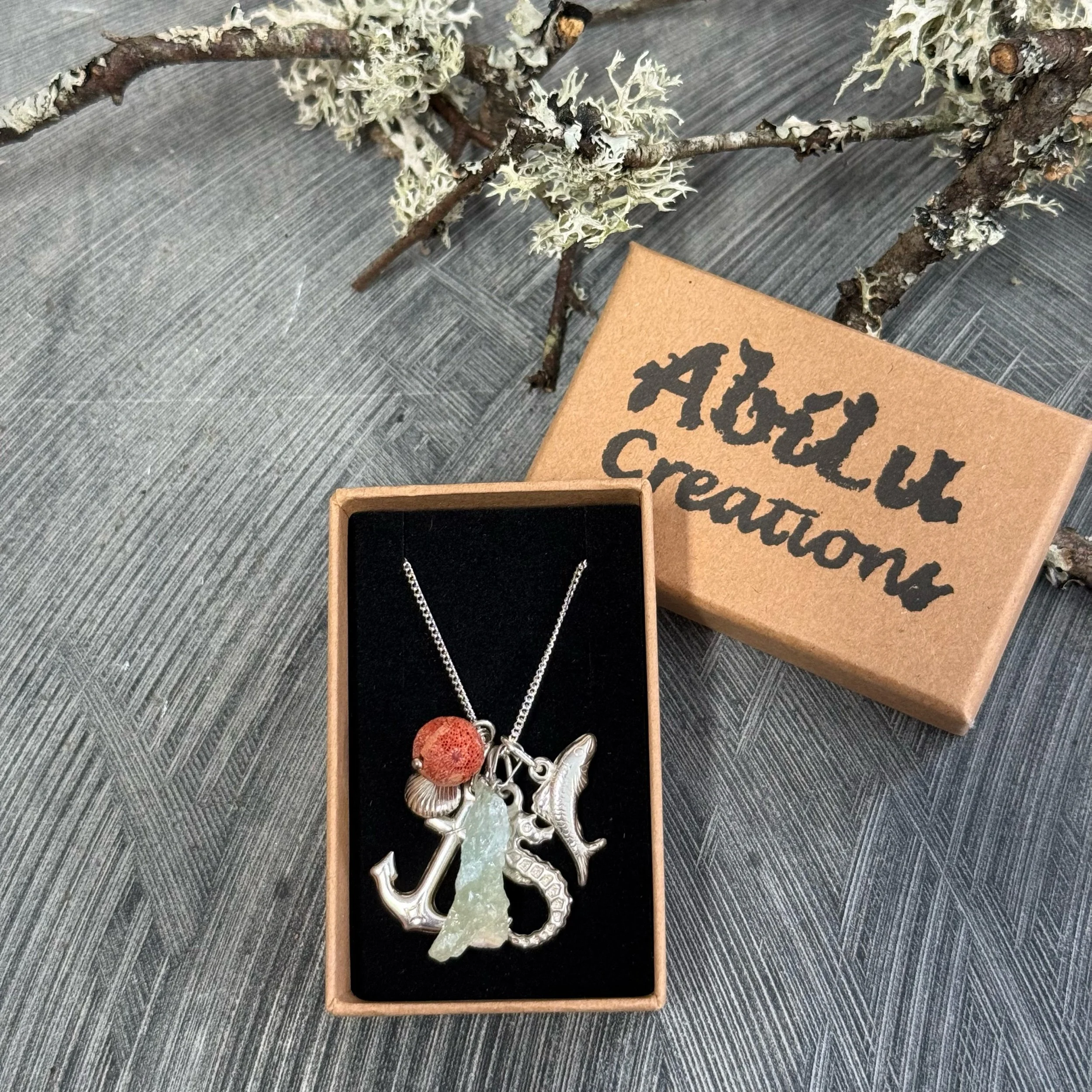 Sterling silver aquamarine and Coral sea charm necklace