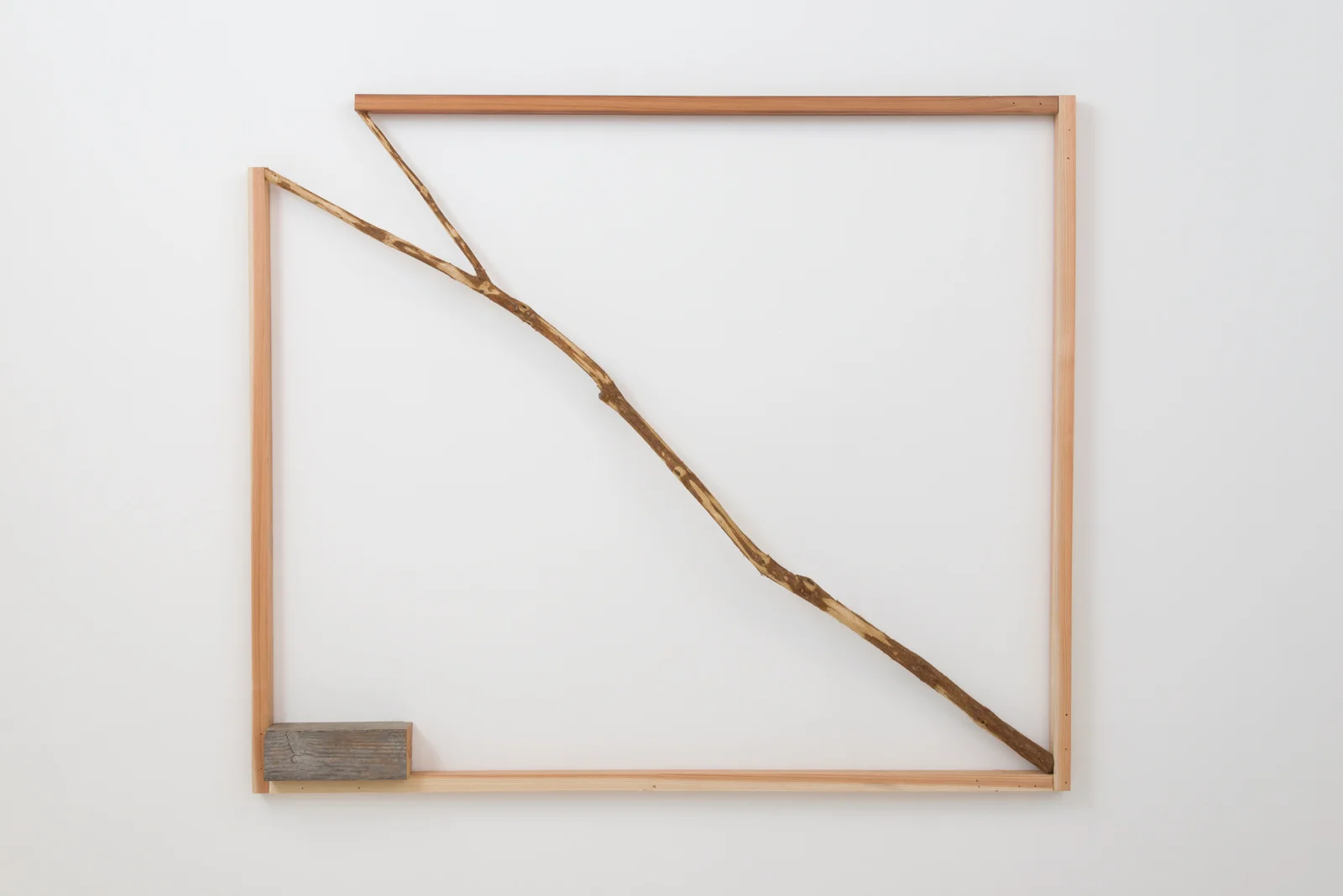 Kishio Suga Opening Situation , 1990-2016 wood, branch 48 x 57 x 4 ½ in. Courtesy of Blum and Poe