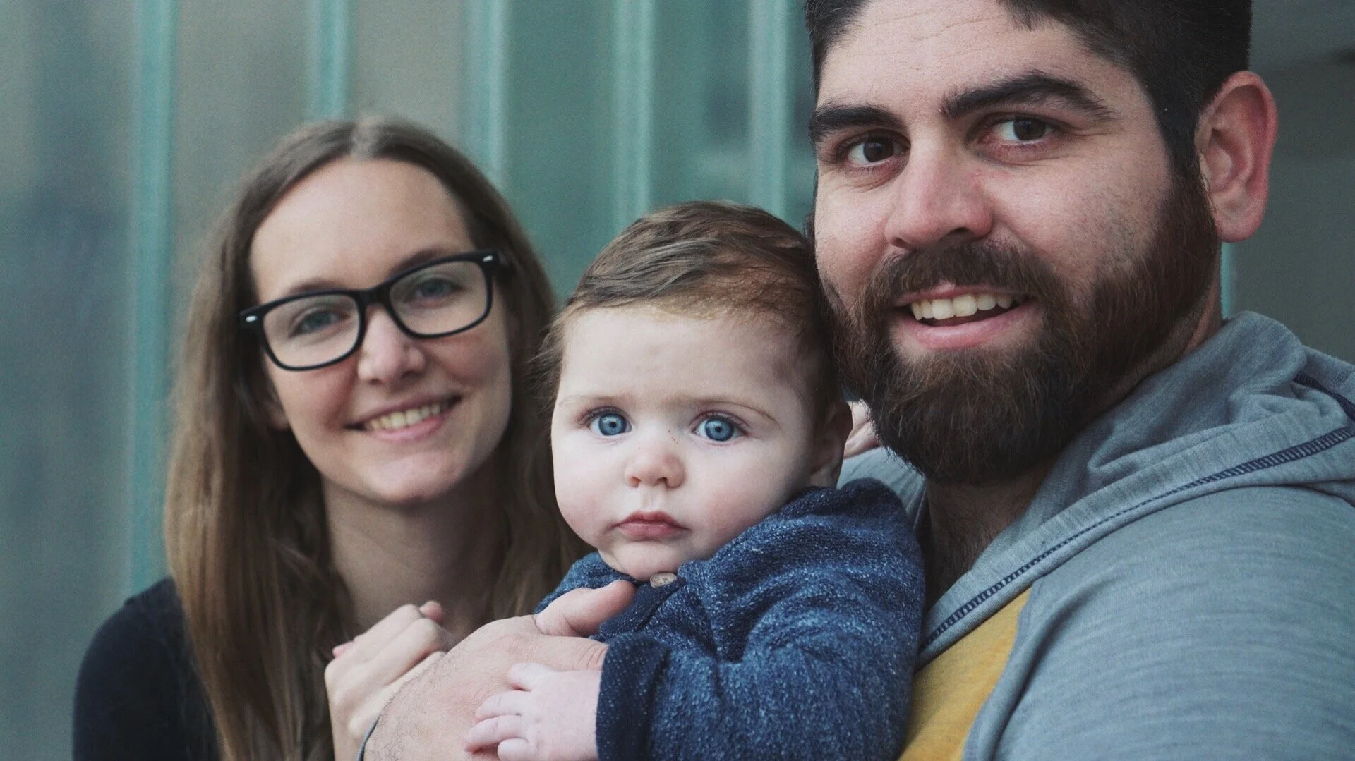  Katy and RJ pose with their 5 month-old son 