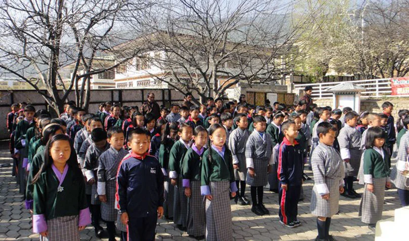 Students practicing ‘brain brushing’, a short mindfulness exercise at the beginning and end of each school day.
