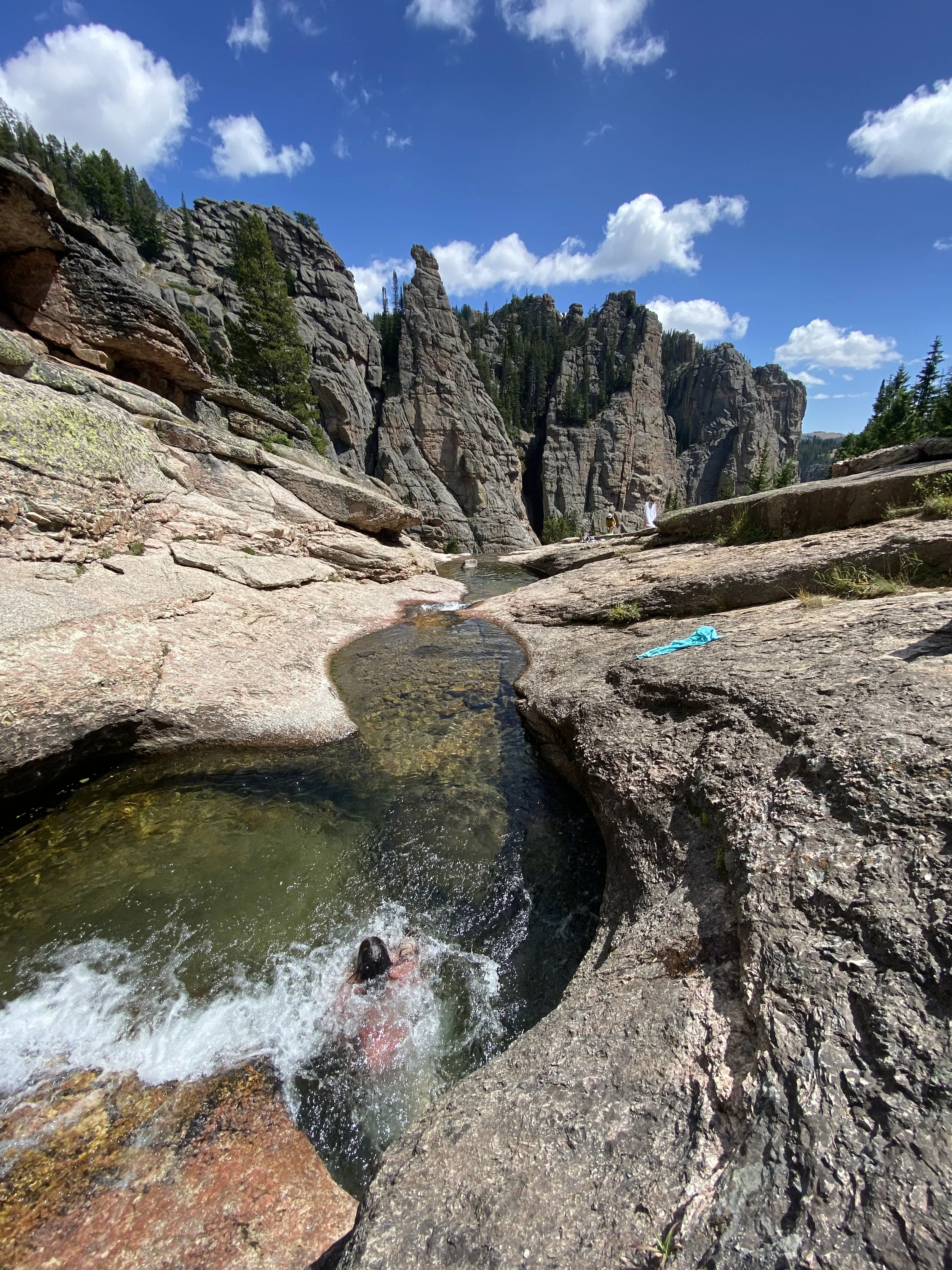 A swimmer in a rock pool in the Bighorn Mountains