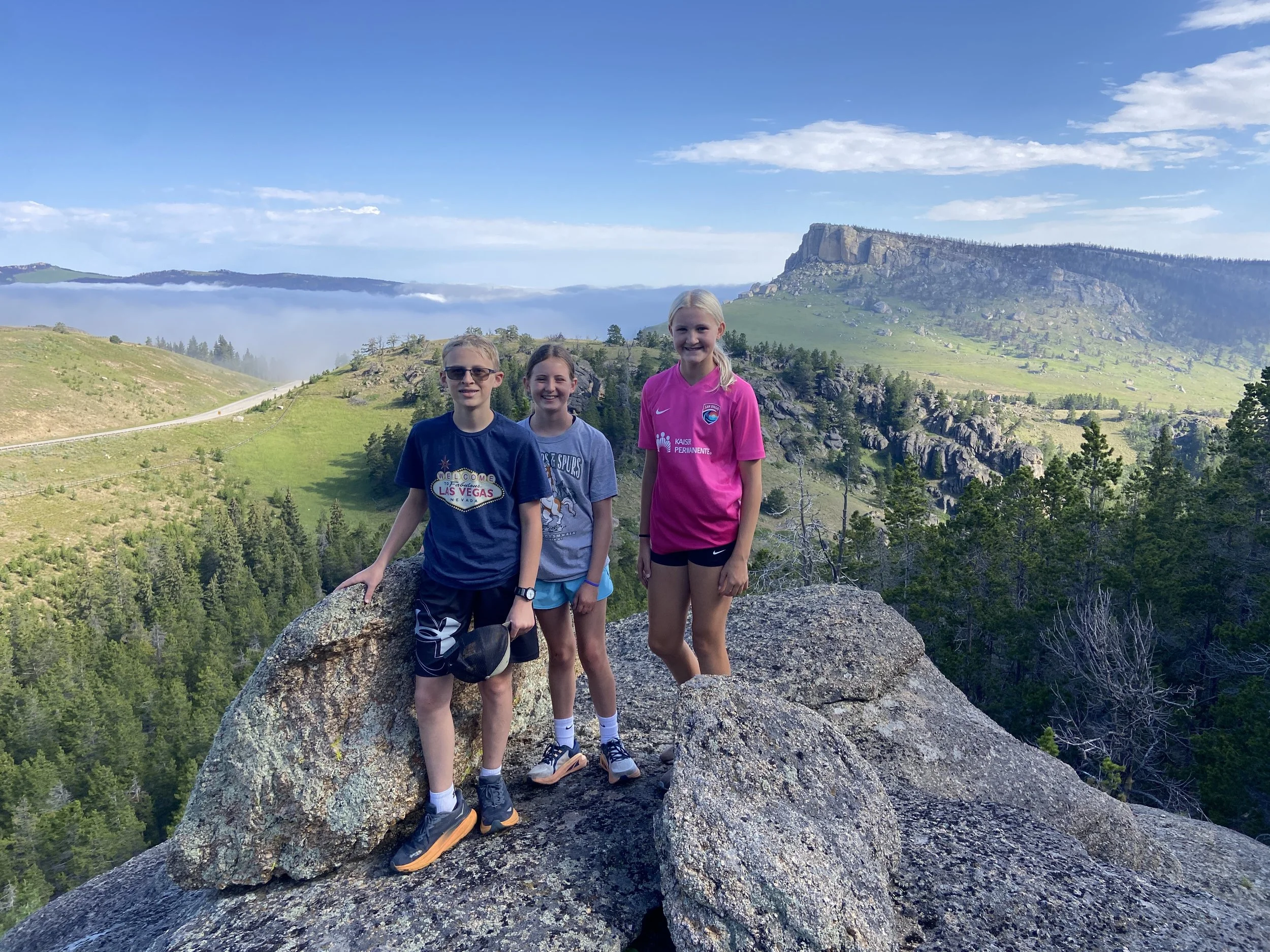 Hikers on a rock in the Bighorn Mountains