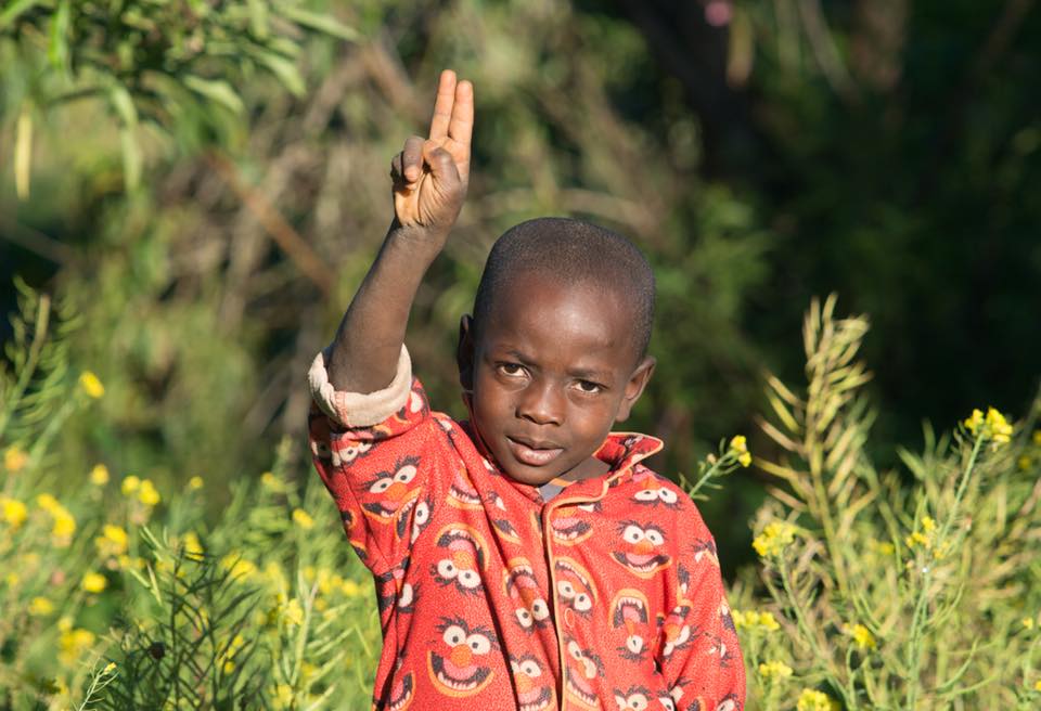  I was out for a walk in rural Haiti when I met this boy who asked me to photograph him pointing to God. 