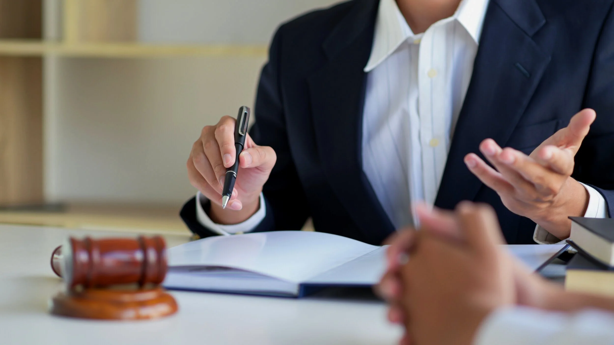cropped-shot-of-lawyers-give-advice-to-clients-in--KZM78FN.jpg