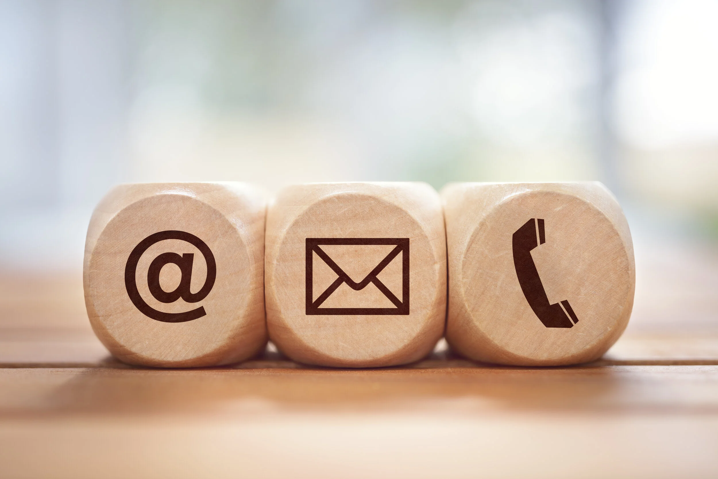 contact-us-concept-with-wood-block-and-symbols-4WPL3VD.jpg