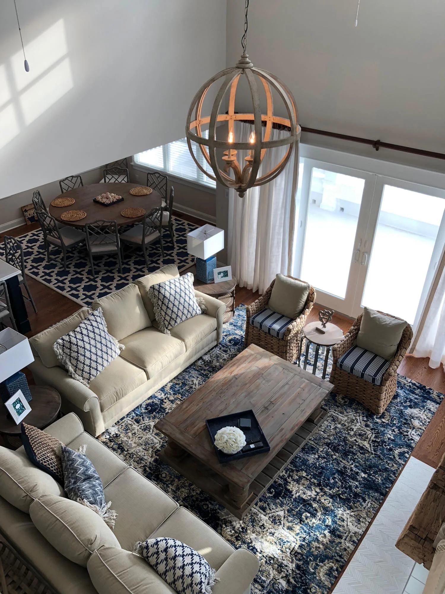 Open concept living room with sofa and sitting chairs