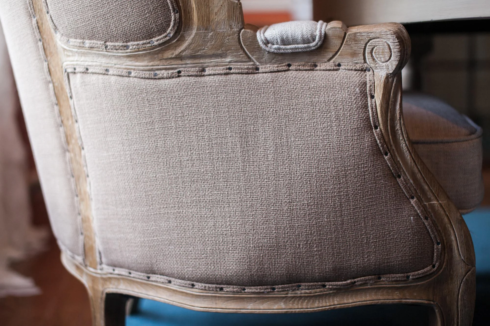 Base of beige burlap textured chair
