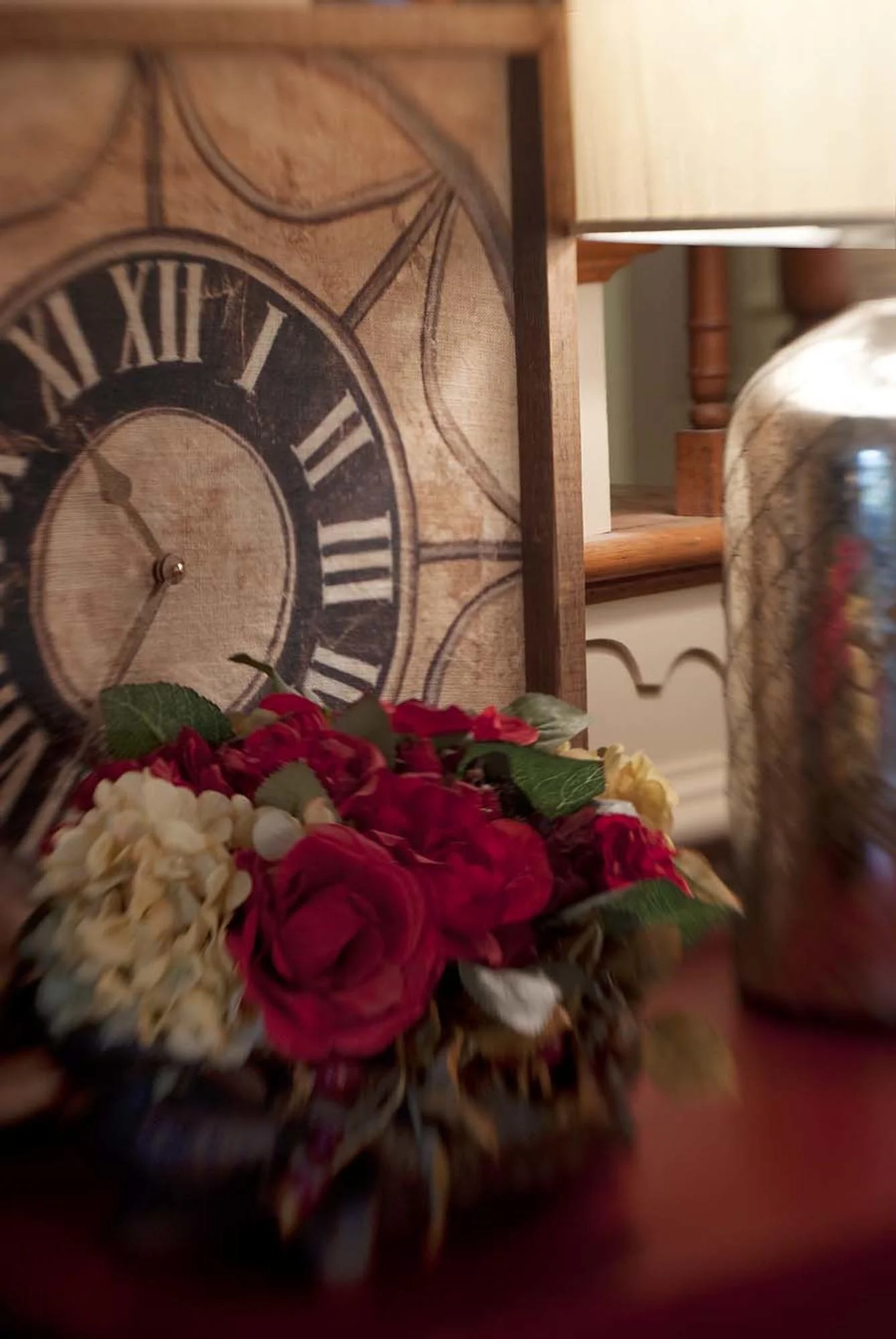 Small bouquet of flowers with retro style clock