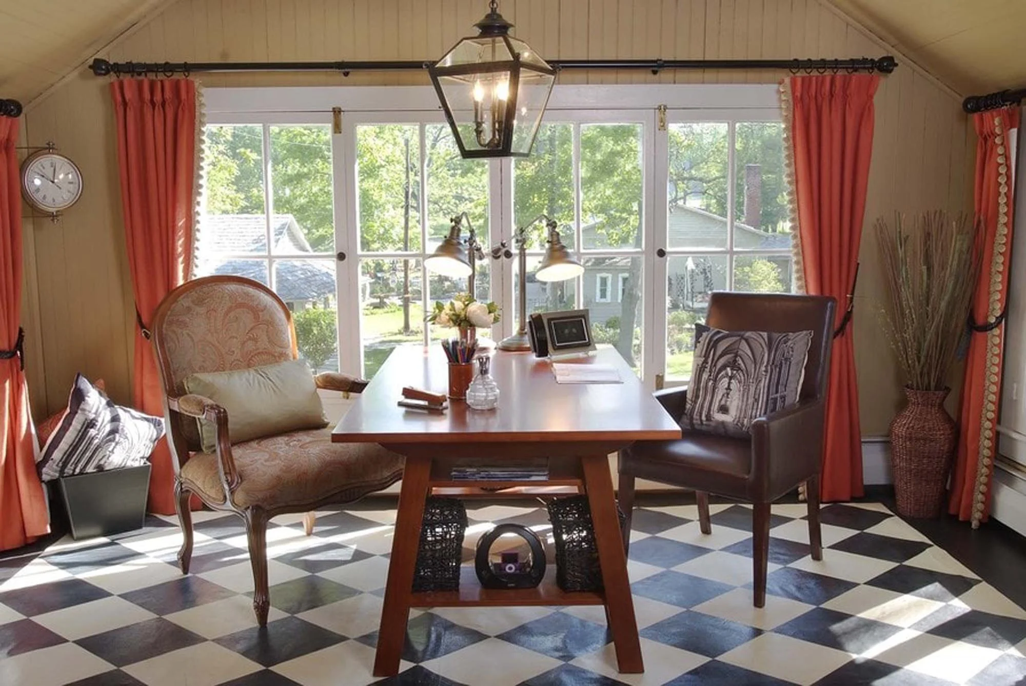 Bright office space with his and her desk and checkered designed floor