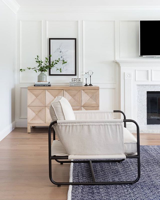 Millwork + moulding detail on walls is a simple update to an otherwise builder-basic home. I've seen lots of great DIYs on Pinterest for it lately, too.

It certainly makes this living room by @lindseybrookedesign feel totally custom!