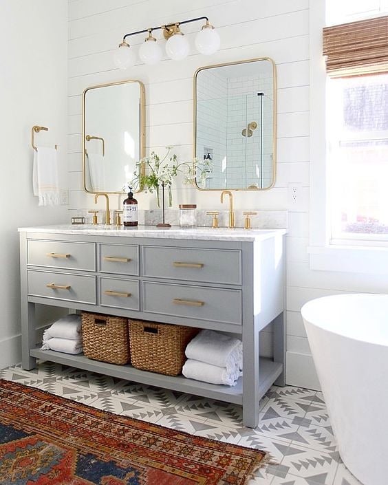 I've said it before + I'll say it again - don't be afraid of pattern in the bathroom! It's one of the only spaces in your home that you can concentrate details without overpowering since it has limited furniture. Love this vintage statement rug layer