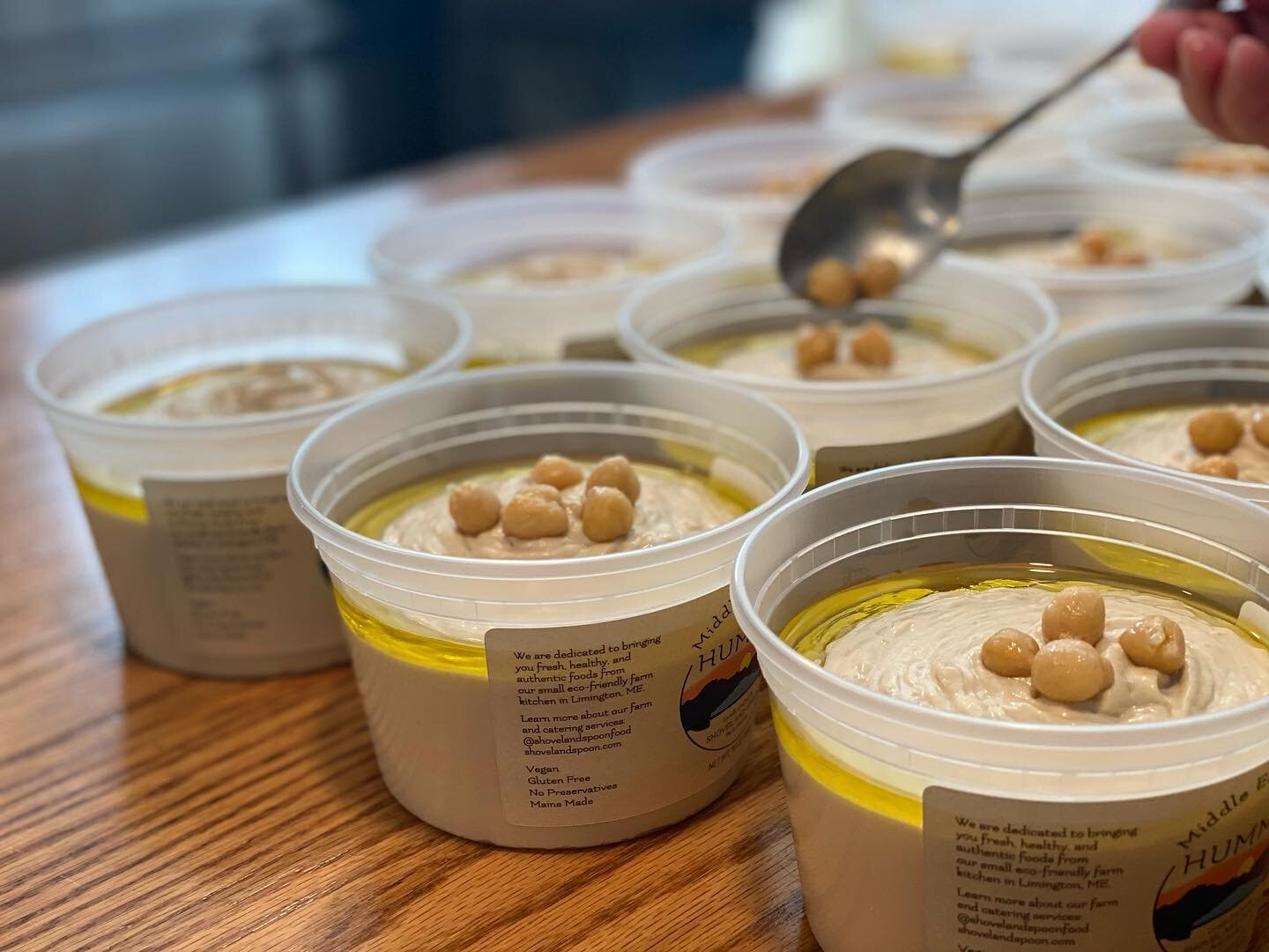 Each tub is hand-garnished with extra virgin olive oil, organic chickpeas, paprika and ❤️. Fresh batch of Middle East Coast Hummus and Tahini Dip out for delivery!
