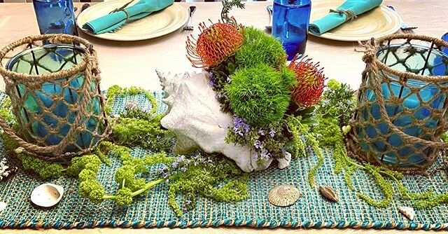 Incorporating floral design into a table scape is so much fun!  This design was for a book club who had read &ldquo;The Salt Path,&rdquo;a book set on a 630 mile hiking path in the UK.  The possibilities are endless!
#tablescapes #seascapetables #sea