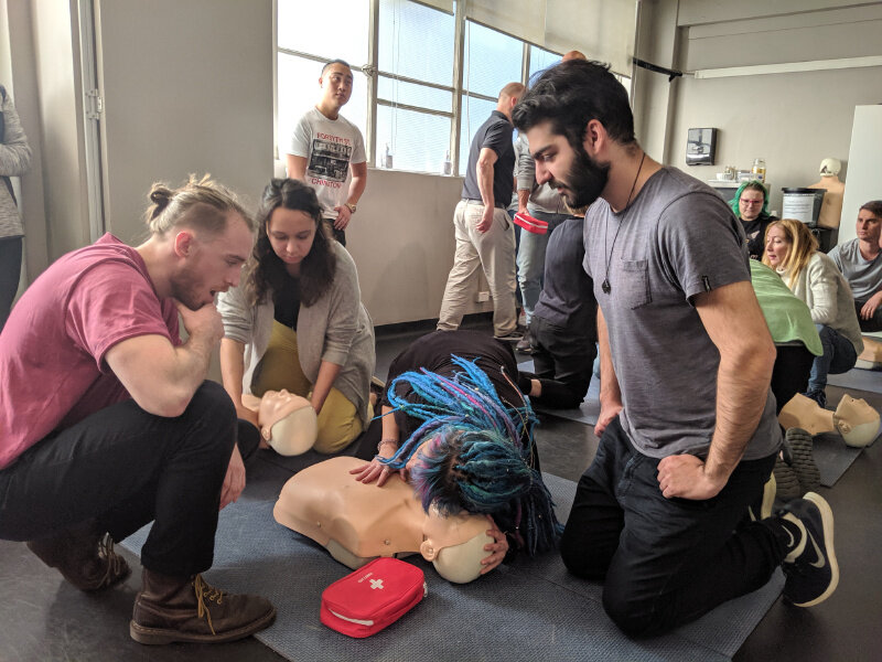 dancewize coordinators doing cpr traning.jpg