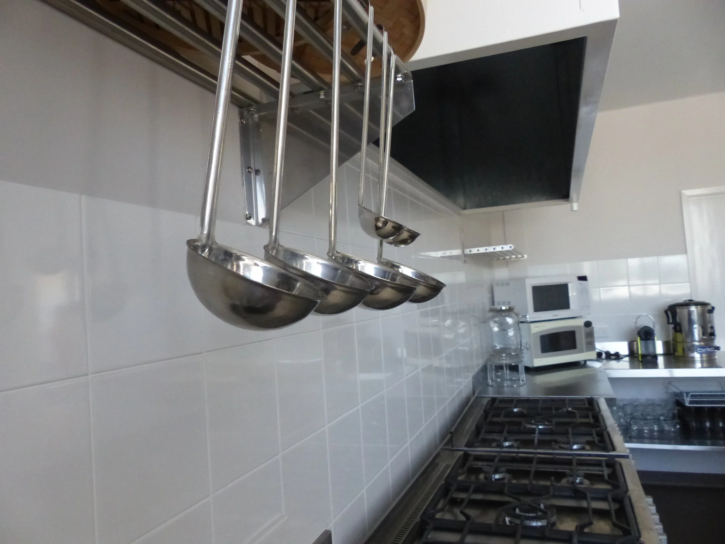 Kitchen Facilities Serving Spoons and Stove Tops.JPG