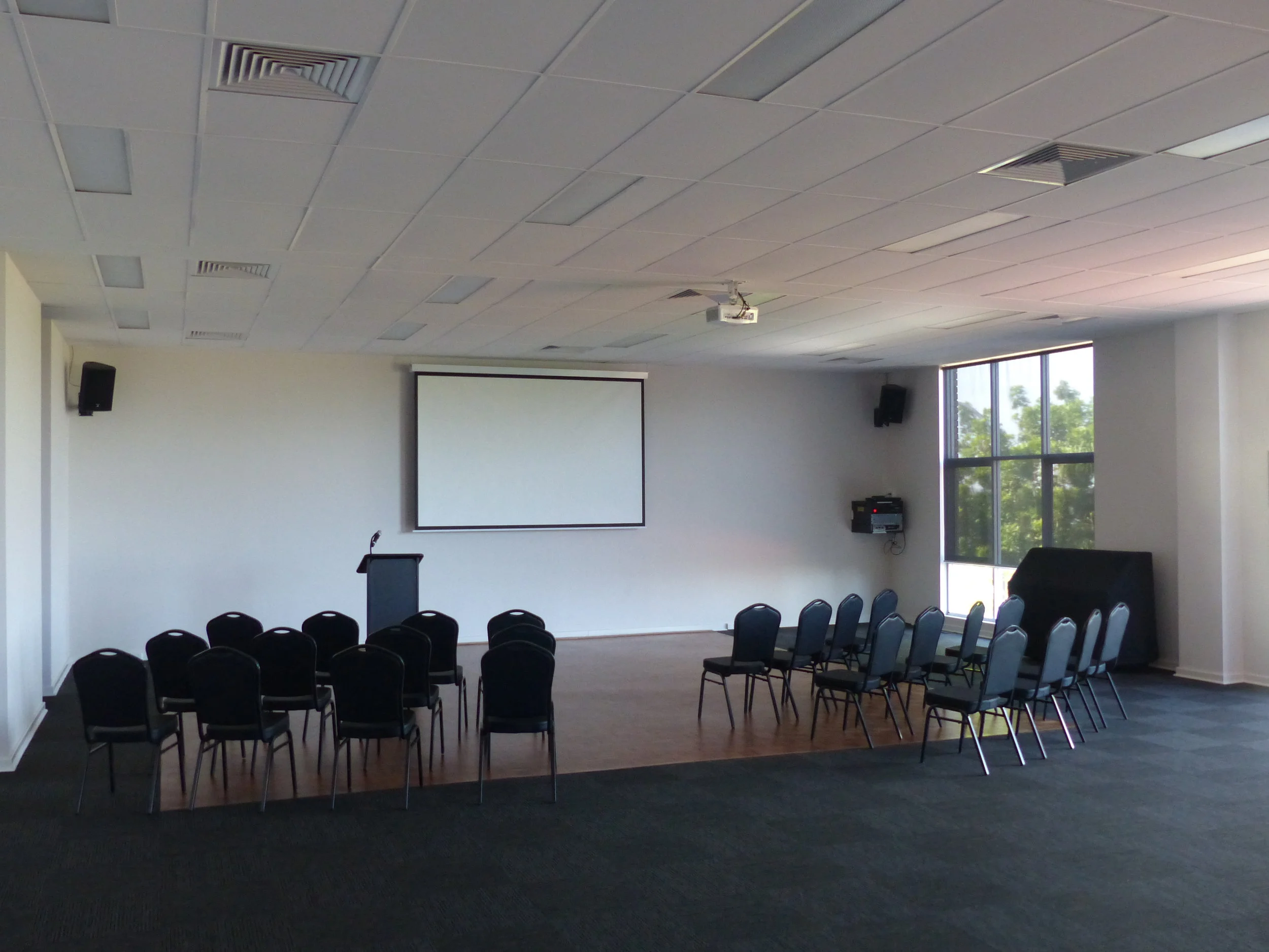 Room in conference layout with screen and lecturn in place1.JPG