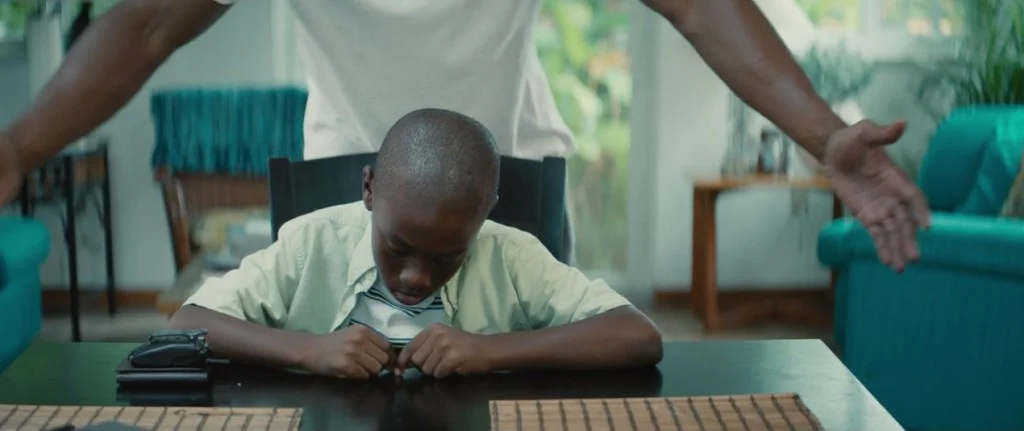 A young Chiron, wearing white—the chromatic motif of the film’s opening.