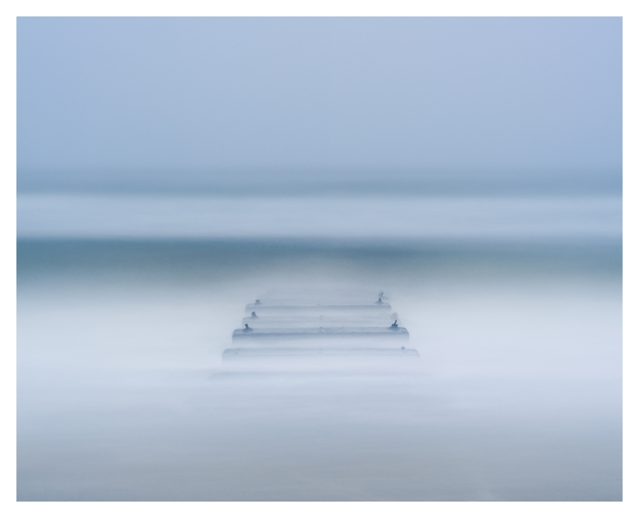 Into the Blue near Nags Head Fishing Pier - Nikon D750 w/80-400mm lens, long exposure with tide coming in.