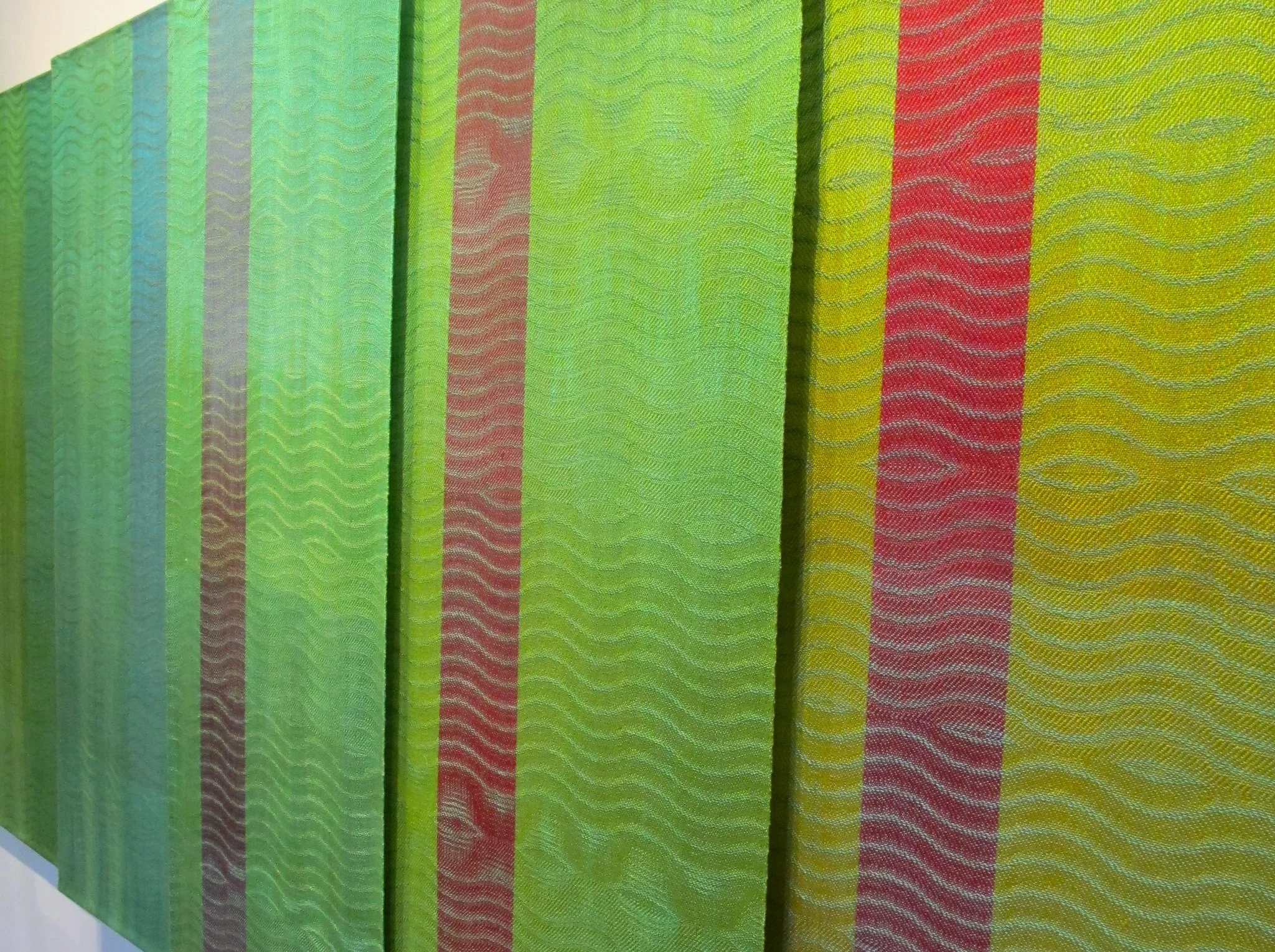 Title: Five Gradation with Green Size: 20” wide x 49” long each 96” wide x 49” long x 6” deep Medium: Hand-dyed, hand-woven Materials: tencel Retail Cost: $5,475