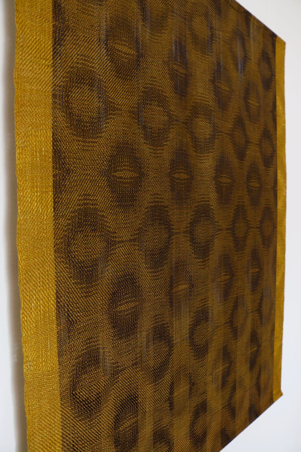  Title: Golden Ovals with Navy to Khaki  Size: 29” wide x 38” long  Medium: Hand-dyed, hand-woven  Materials: tencel  For process information and pricing, please contact us by clicking on this  link . 