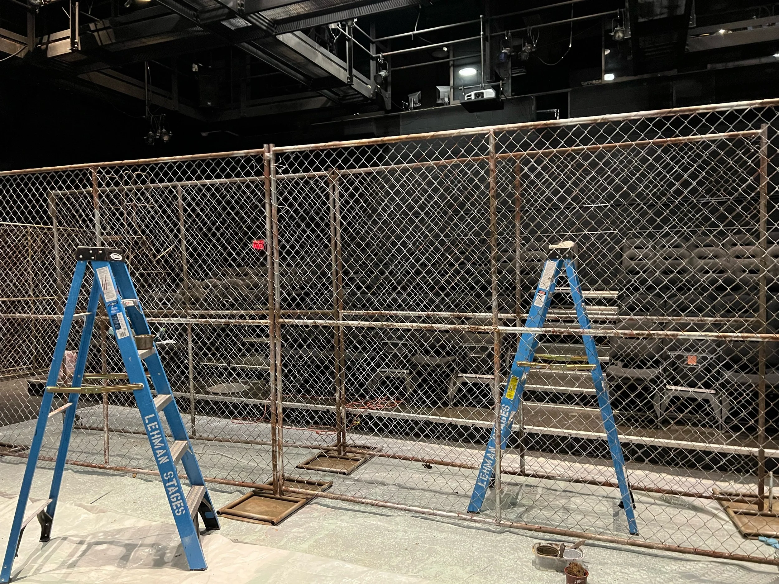 "Fidelio," Faux rusted fence