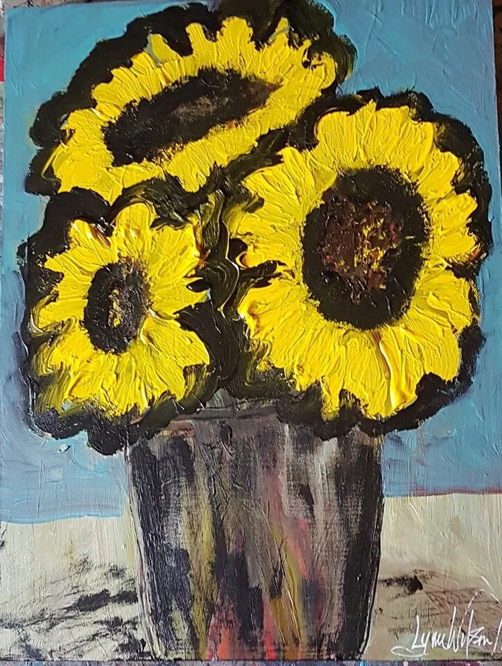 Sunflowers bright yellow with heavy black outline in black red and yellow vase with blue wall and whiteish table on wood cradle panel April 2019.jpg
