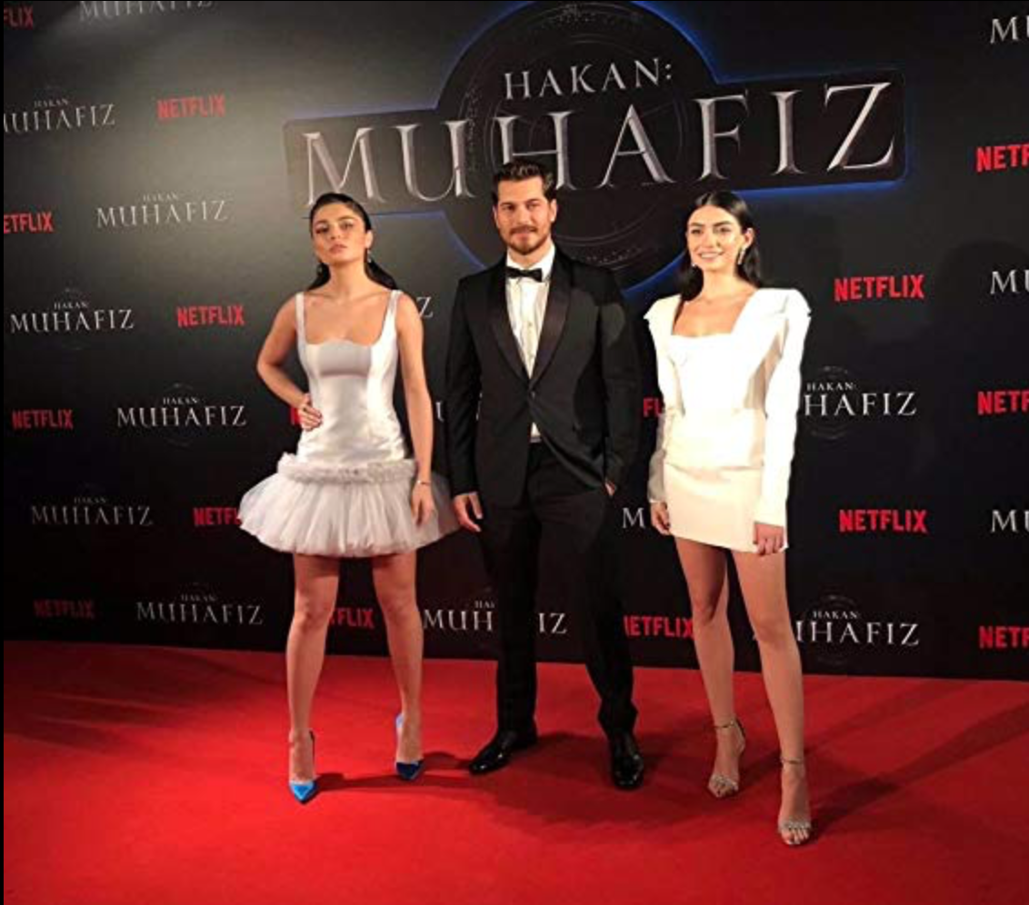 Hazar alongside fellow cast members Çagatay Ulusoy, and Ayça Aysin Turan, at the Premiere of “The Protector”.