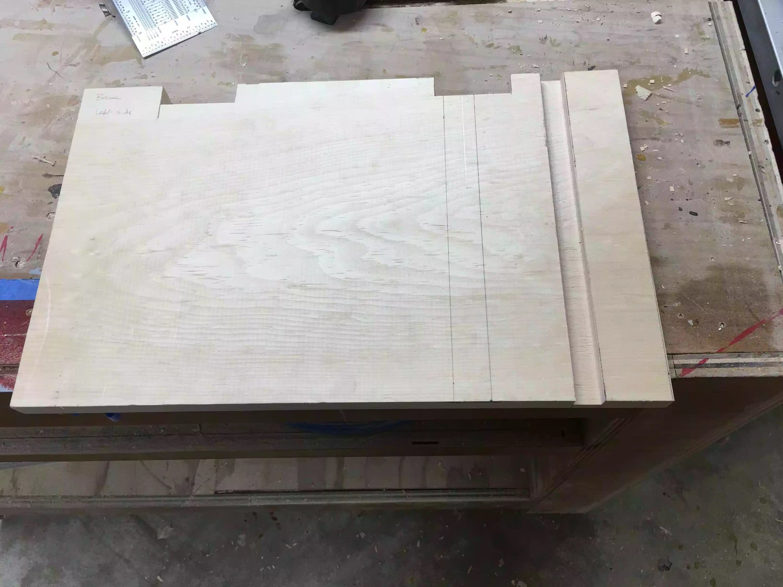 In this picture you can see the base with the notches cut out in the back and the first dado cut into the the right side. (More to come on this part)