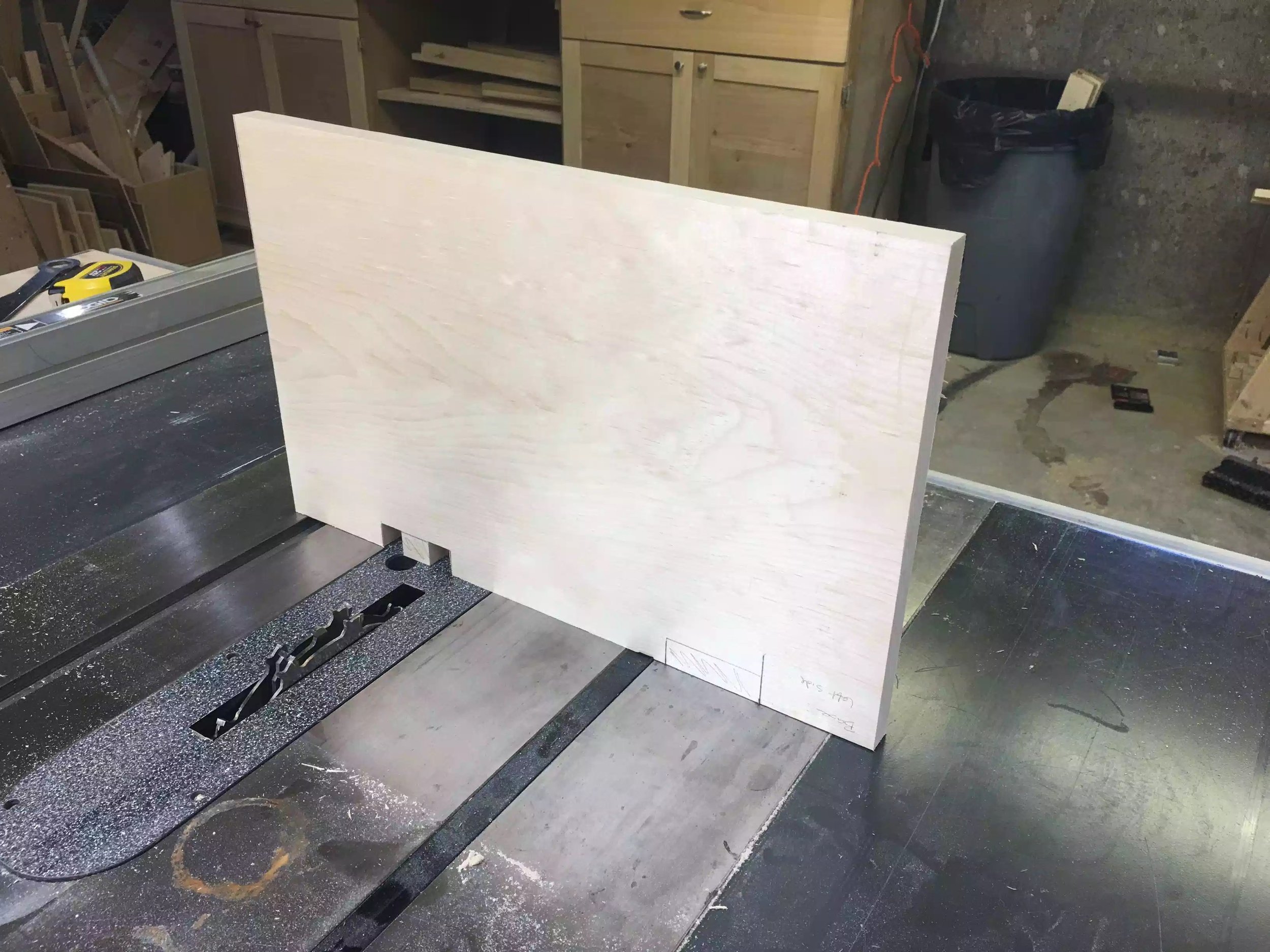 In this picture you can see me cutting the back notches using my dado stack . You cant see it but I used my miter gauge to support this cut to minimize tear out.