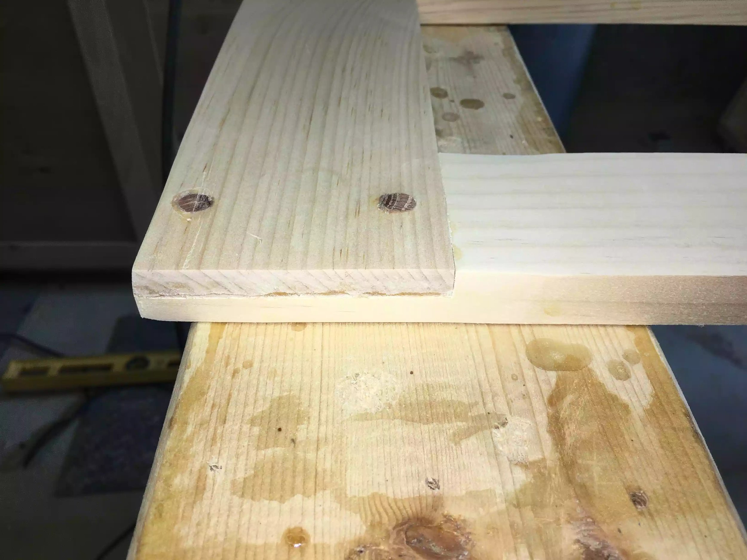 Almost finished, the dowles have been trimmed flush and the excess glue has been reoved, you can see the half-lap joint on the edge. Just need to clean up the joint a little.