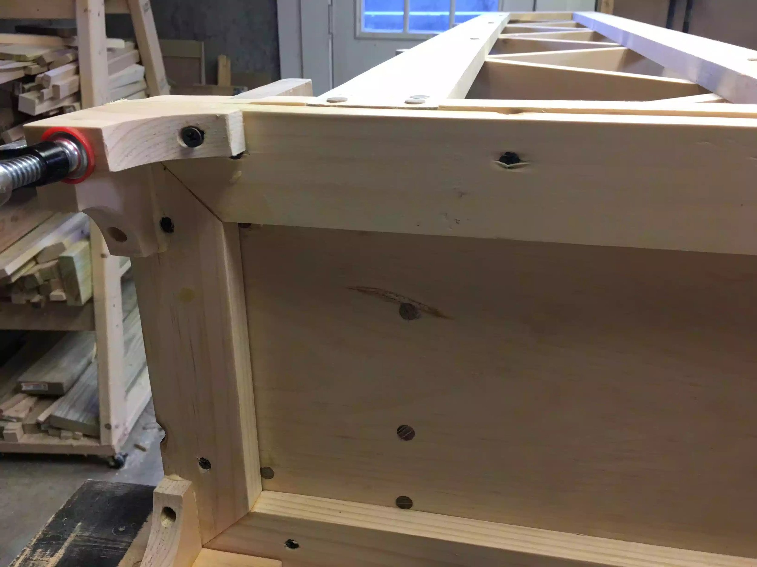 Here is the mitered frame attached to the base , I used 1 1/4" drywall screws to attach it, and that's it, making sure the frame was flush to the back and that the over hang on the front and the sides matched the thickness of the molding I made.