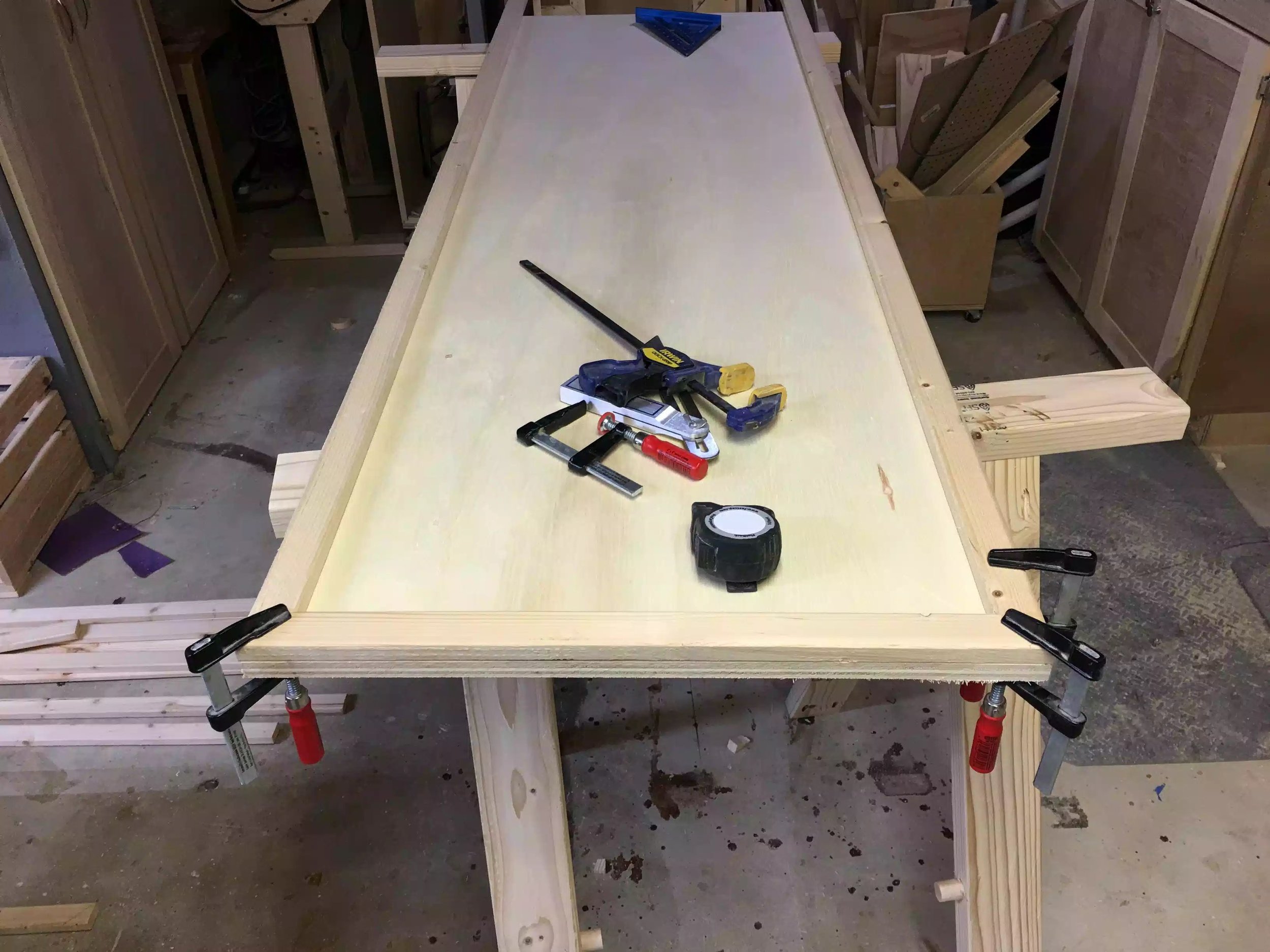 Here I am trying to get correct miter cuts on the corners, I used clamps to secure the corners to make sure they line up when it comes to securing them.