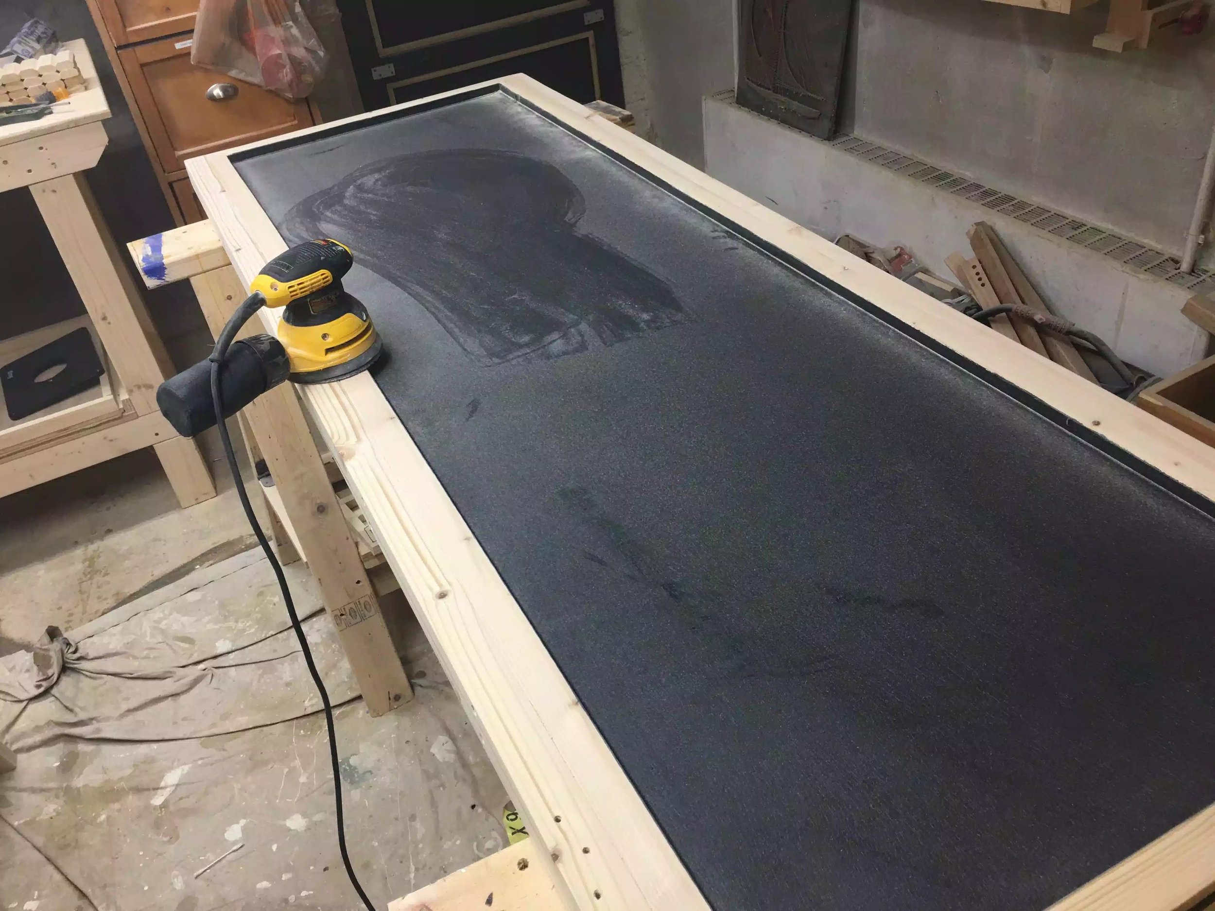 Here I am using my orbital sander after the paint had dried, as you can see it created a lot of dust build up on the panel, so I just vacummed that up and wiped it down with a damp rag. I sanded it as before from 80 grit - 220 grit