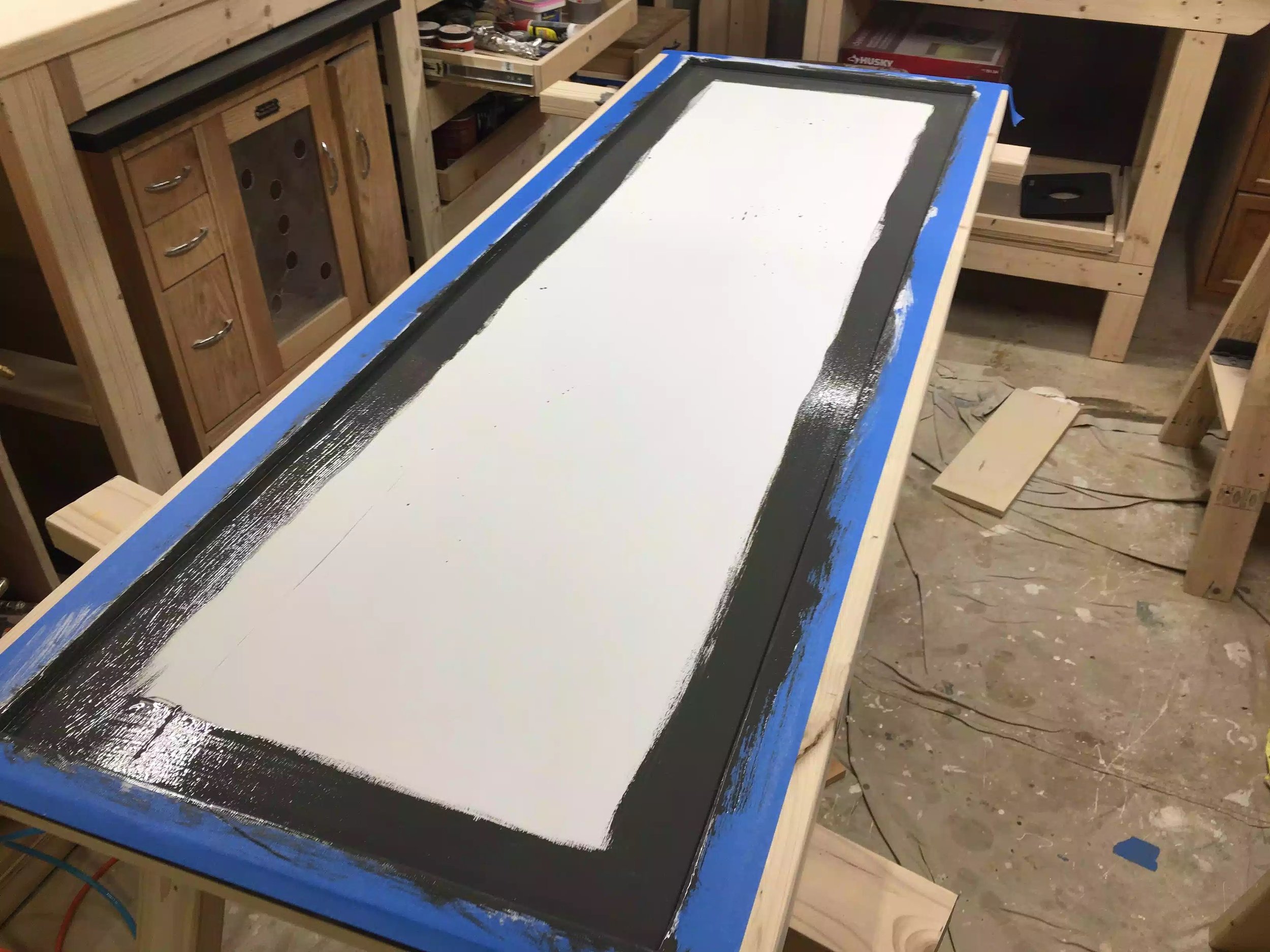 I used a brush to cut the paint into the sides and then came back with a roller to do the rest of the panel