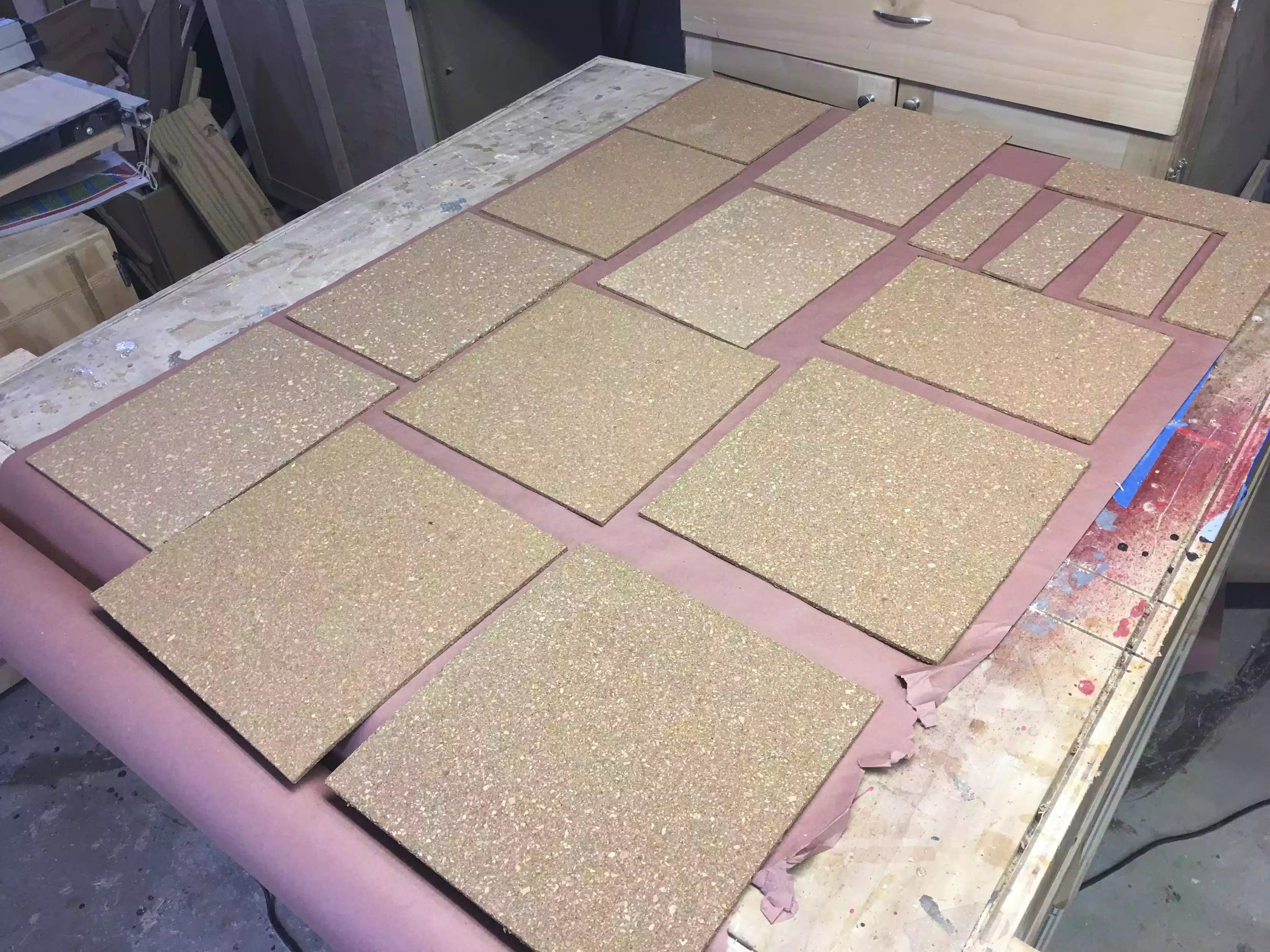 Here you can see the cork board tiles all laid out on my out-feed table ready to receive the spray adhesive